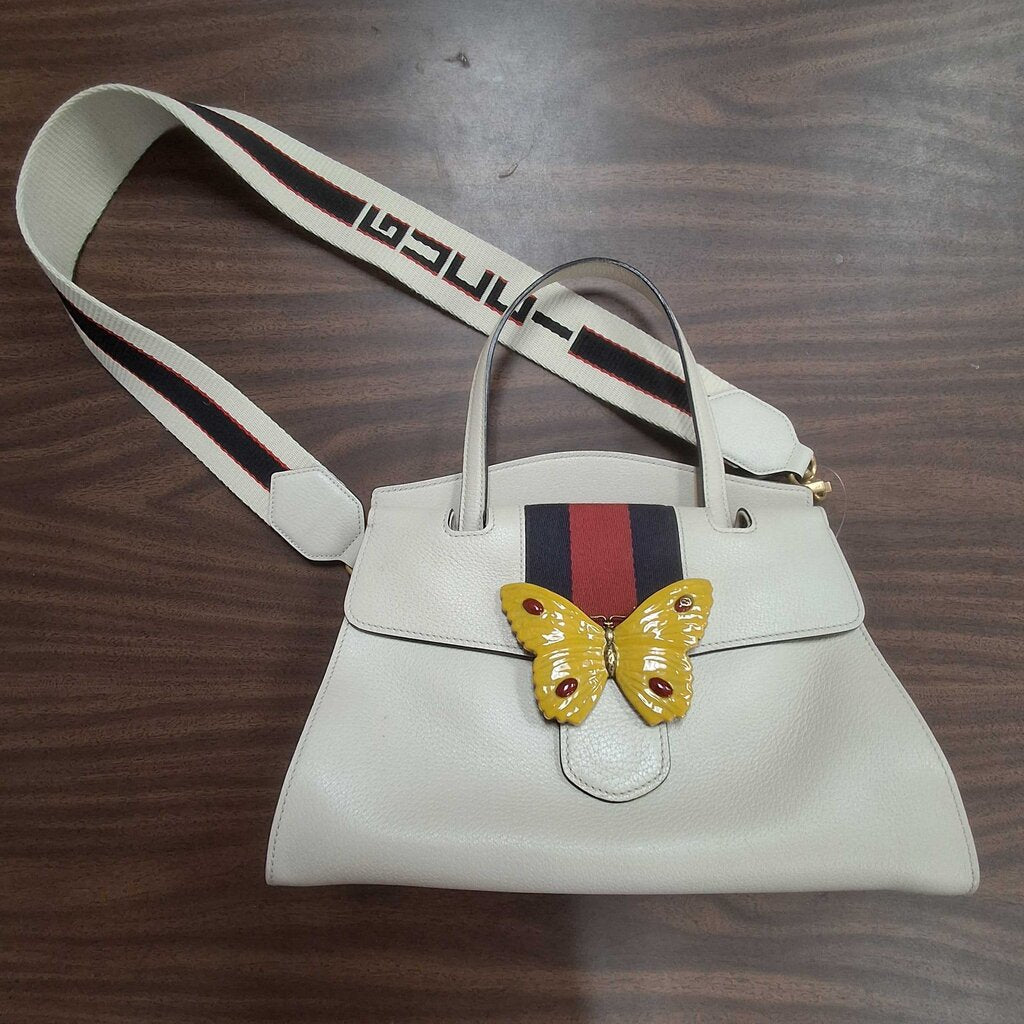 Gucci leather purse/enamel butterfly