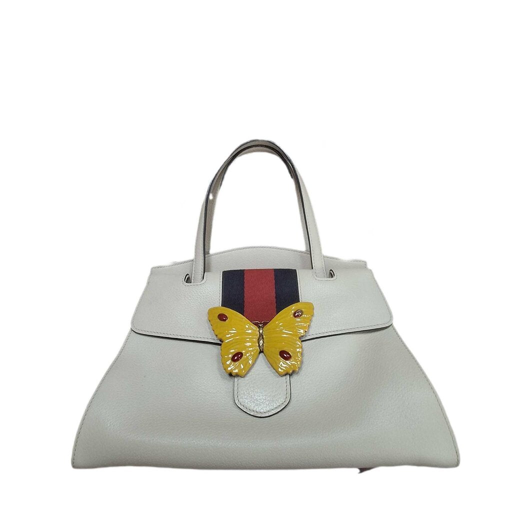 Gucci leather purse/enamel butterfly