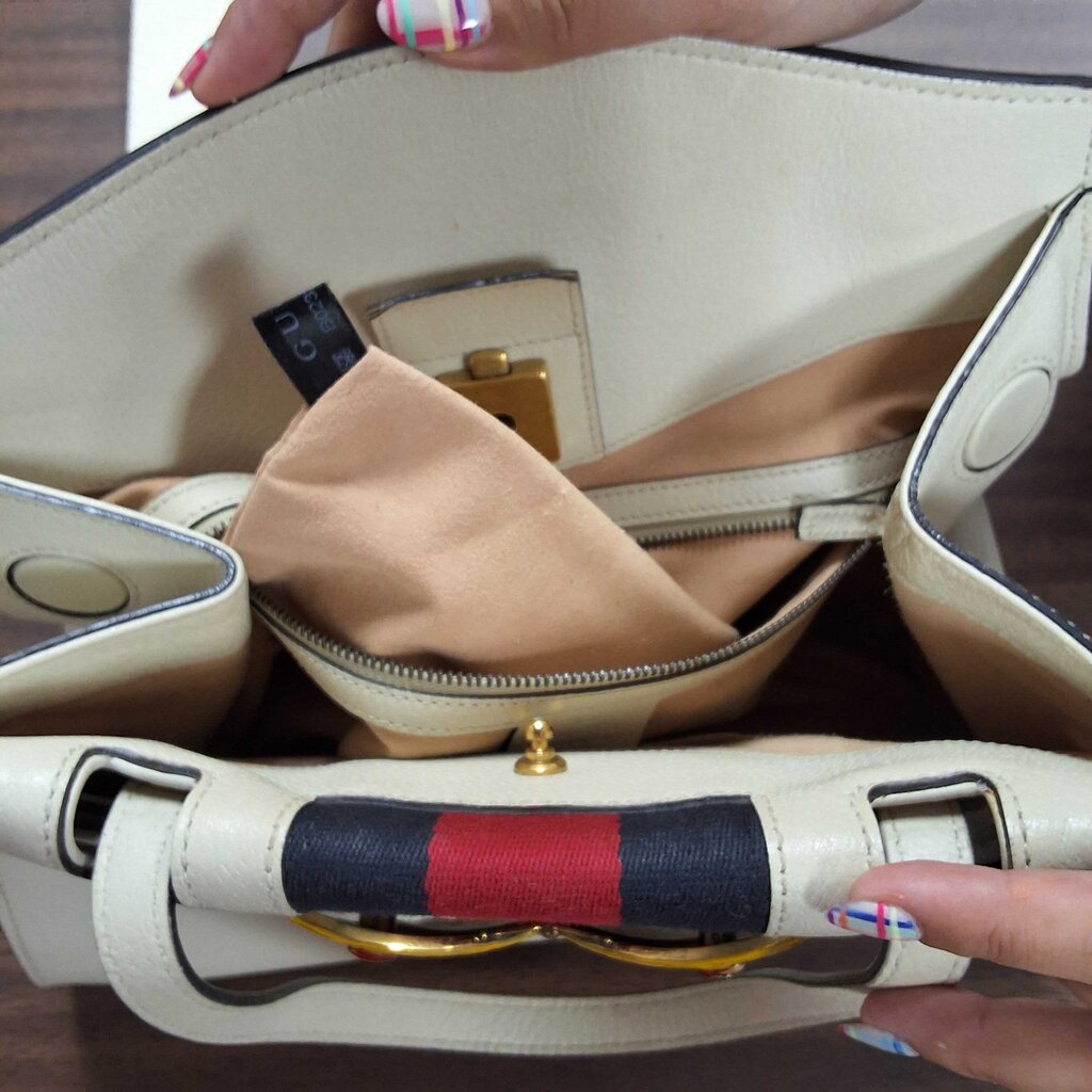 Gucci leather purse/enamel butterfly